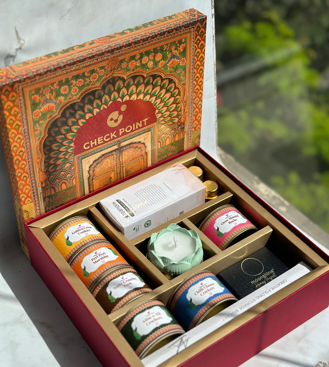 A 45 degree top angle shot of the customized luxury Diwali gift hamper ordered by Check Point in 2023