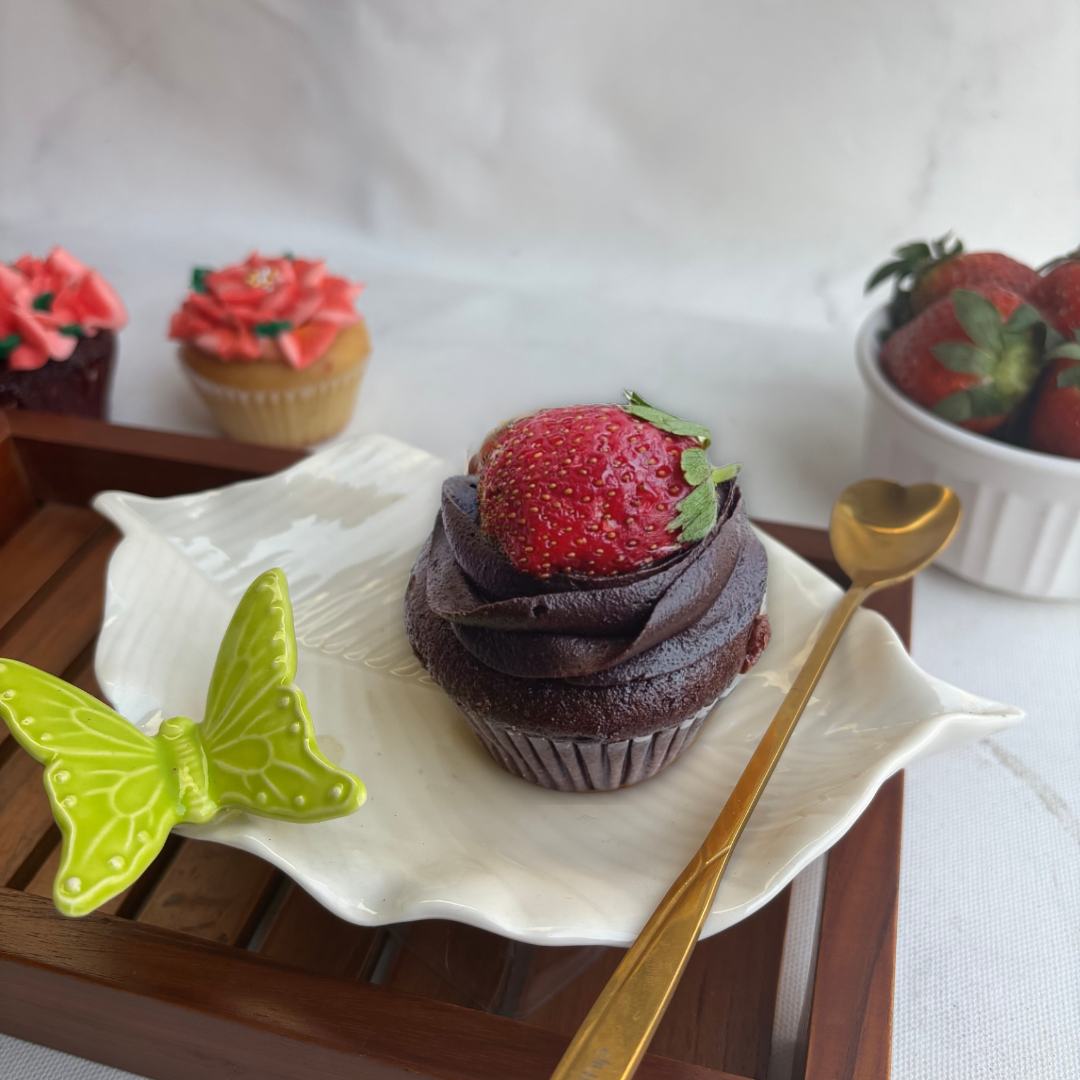 Moist chocolate cupcake with strawberry filling topped with our rich ganache and juicy fresh strawberry. finger licking good. strawberry cupcake. desserts in bangalore