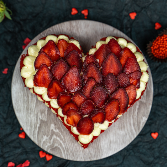 strawberry pinata cake loaded with fresh strawberry between layers of red velvet and luscious cream cheese frosting available for home delivery in bangalore