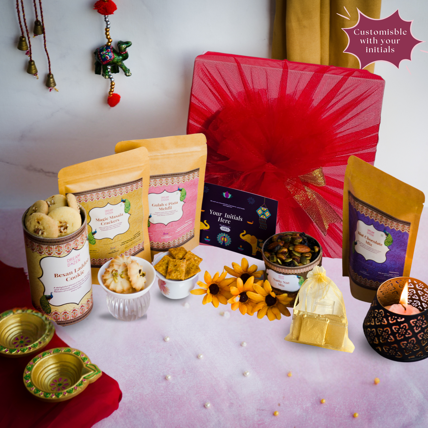 A top down shot of our 10-inch Wedding gift hamper for employees under ₹3000 with a peacock diya lid design that can be logo-branded and is customisable in small quantities. perfect wedding gift hamper for in-laws, family and friends. best personalised return gift for loved ones